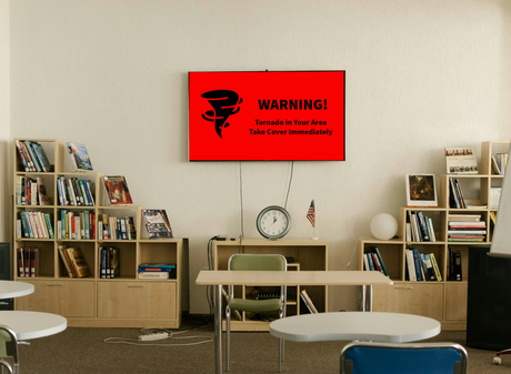 Tornado warning on red digital screen in a classroom